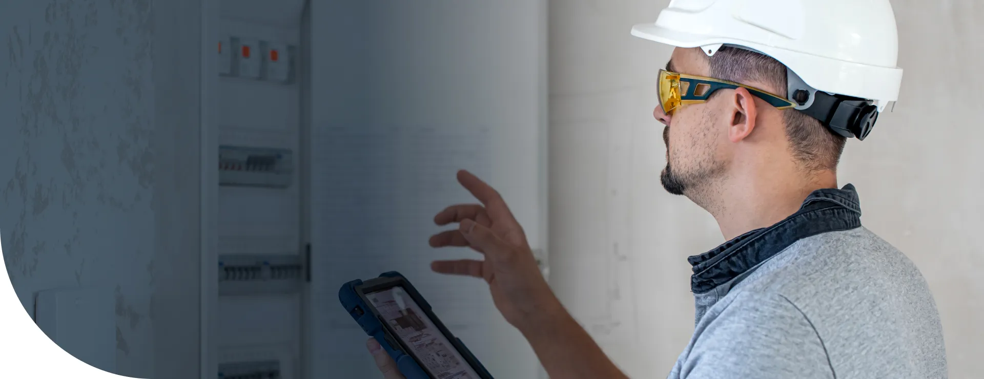 Electrician Looking at Panel