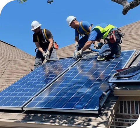 Roofers installing solar panels